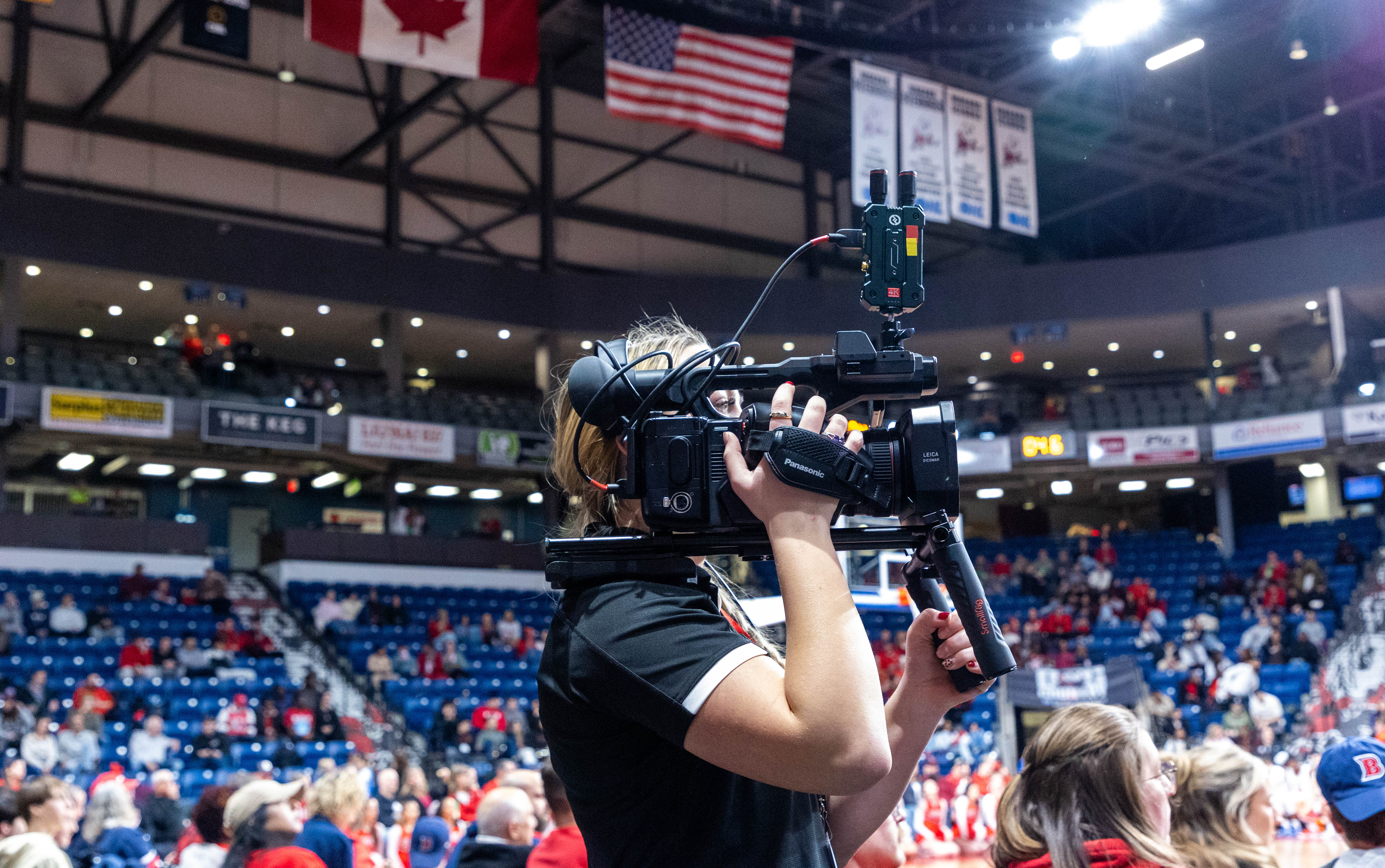 BrockTV producer operating a camera.