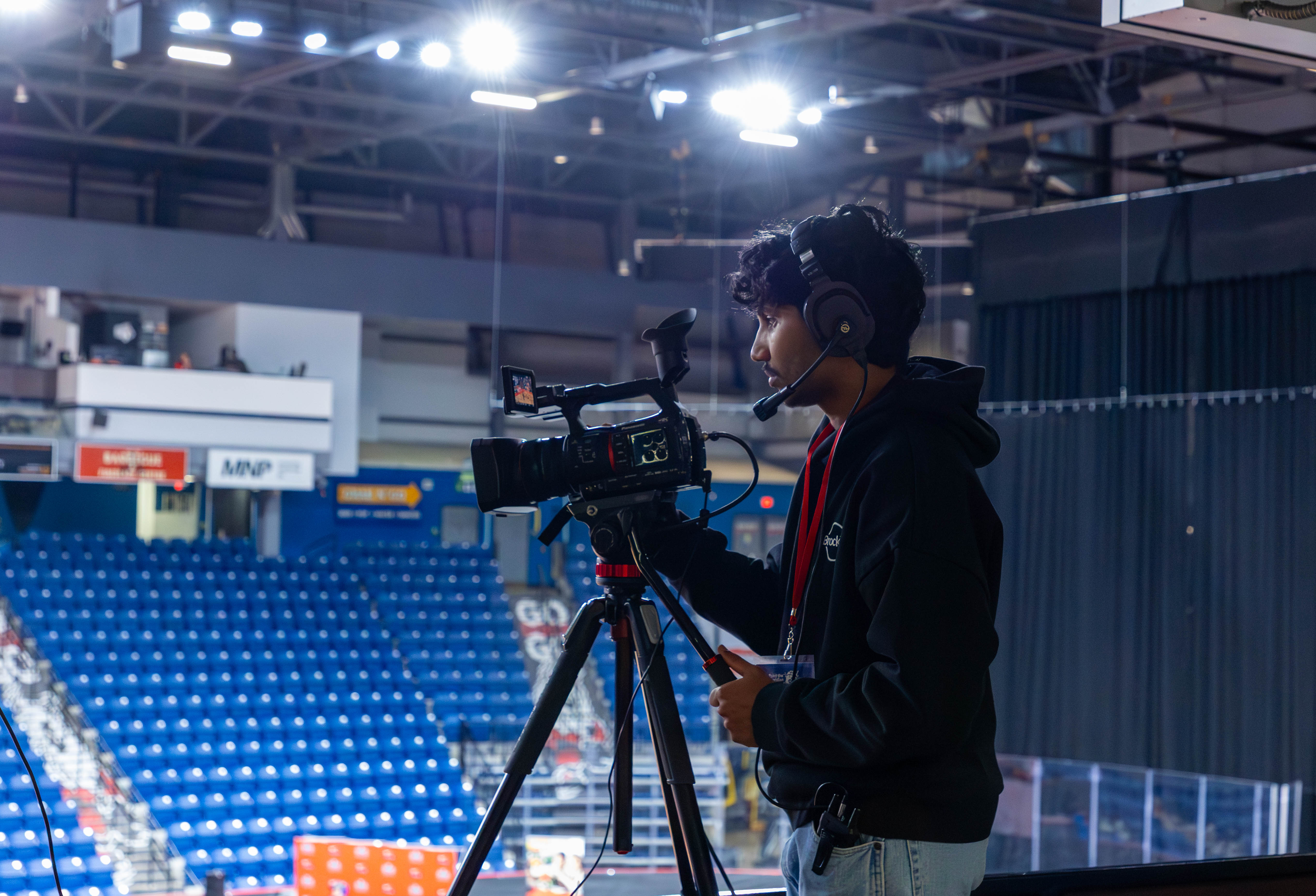 BrockTV producer operating a camera.