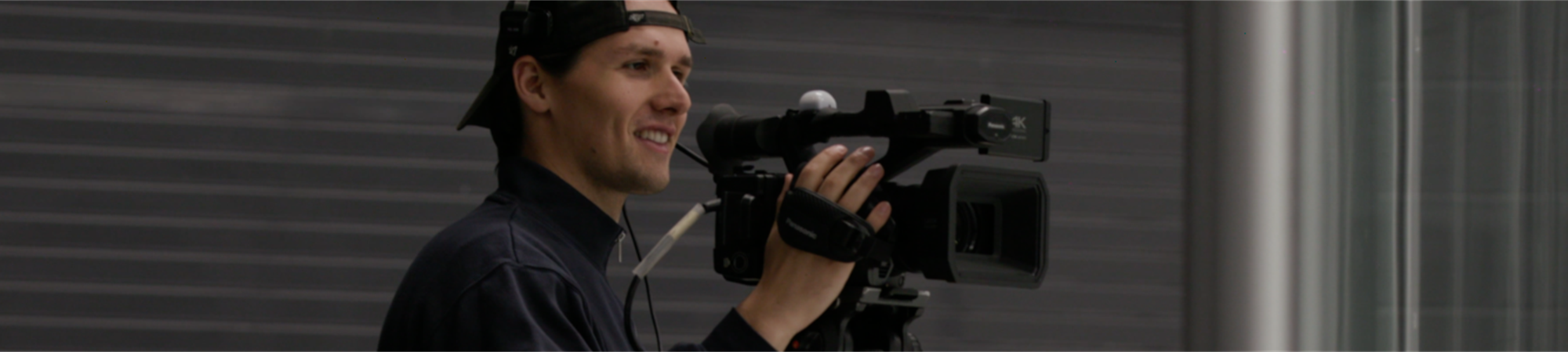 BrockTV producer operating a camera.