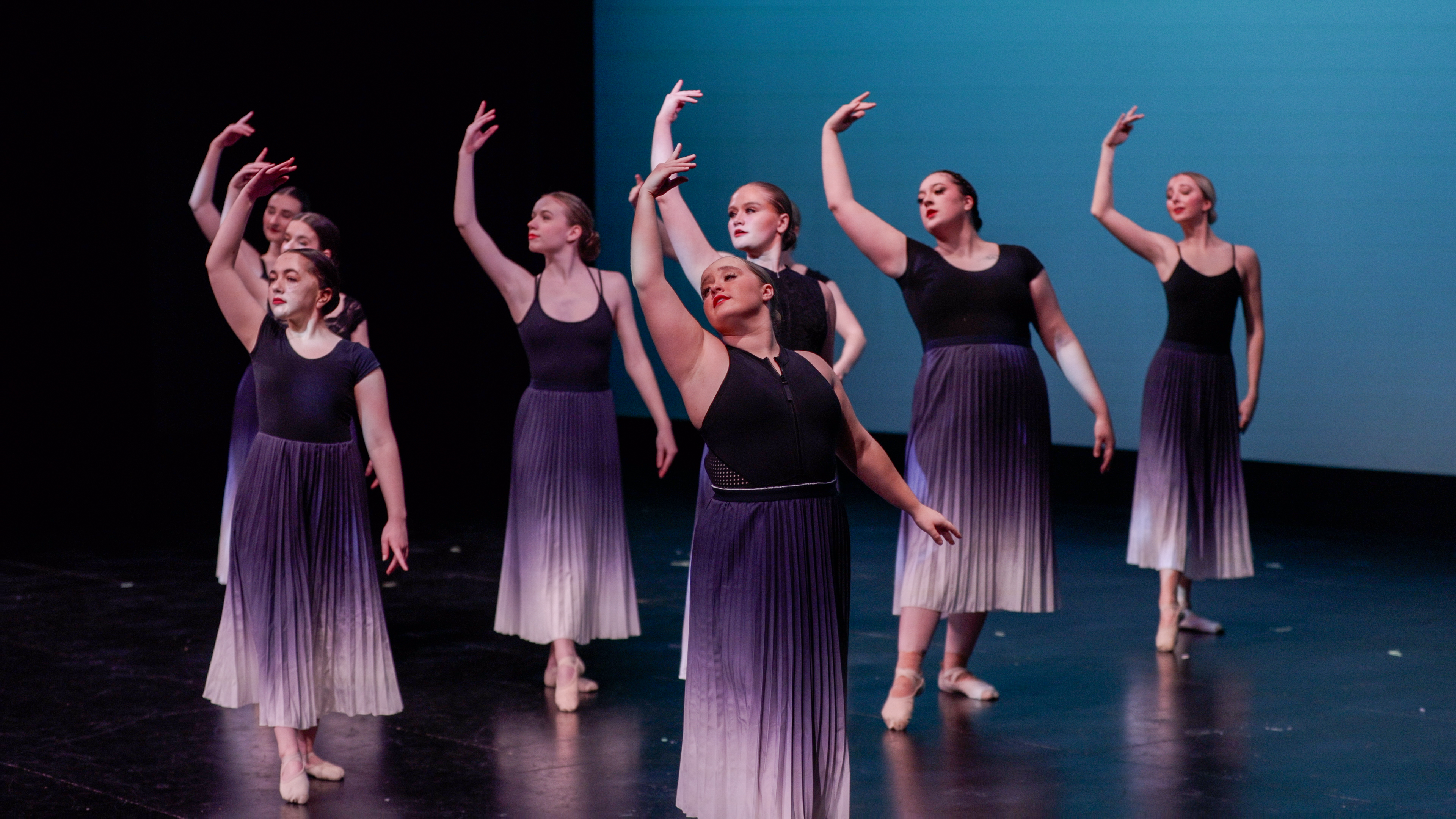 Dance club dancing on stage during one of their events