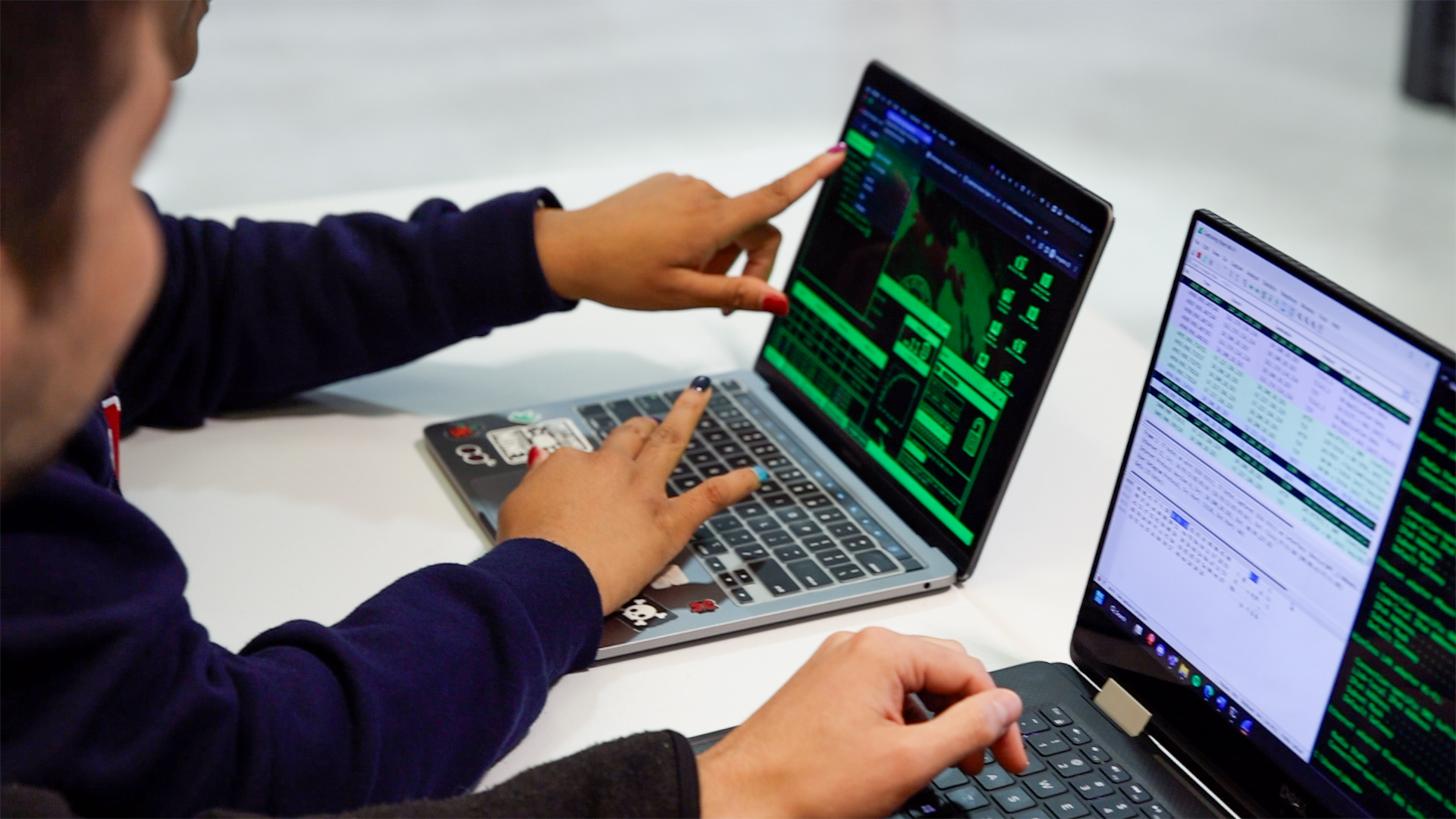 BUSU Clubs Forms. Photo of students looking at laptops.